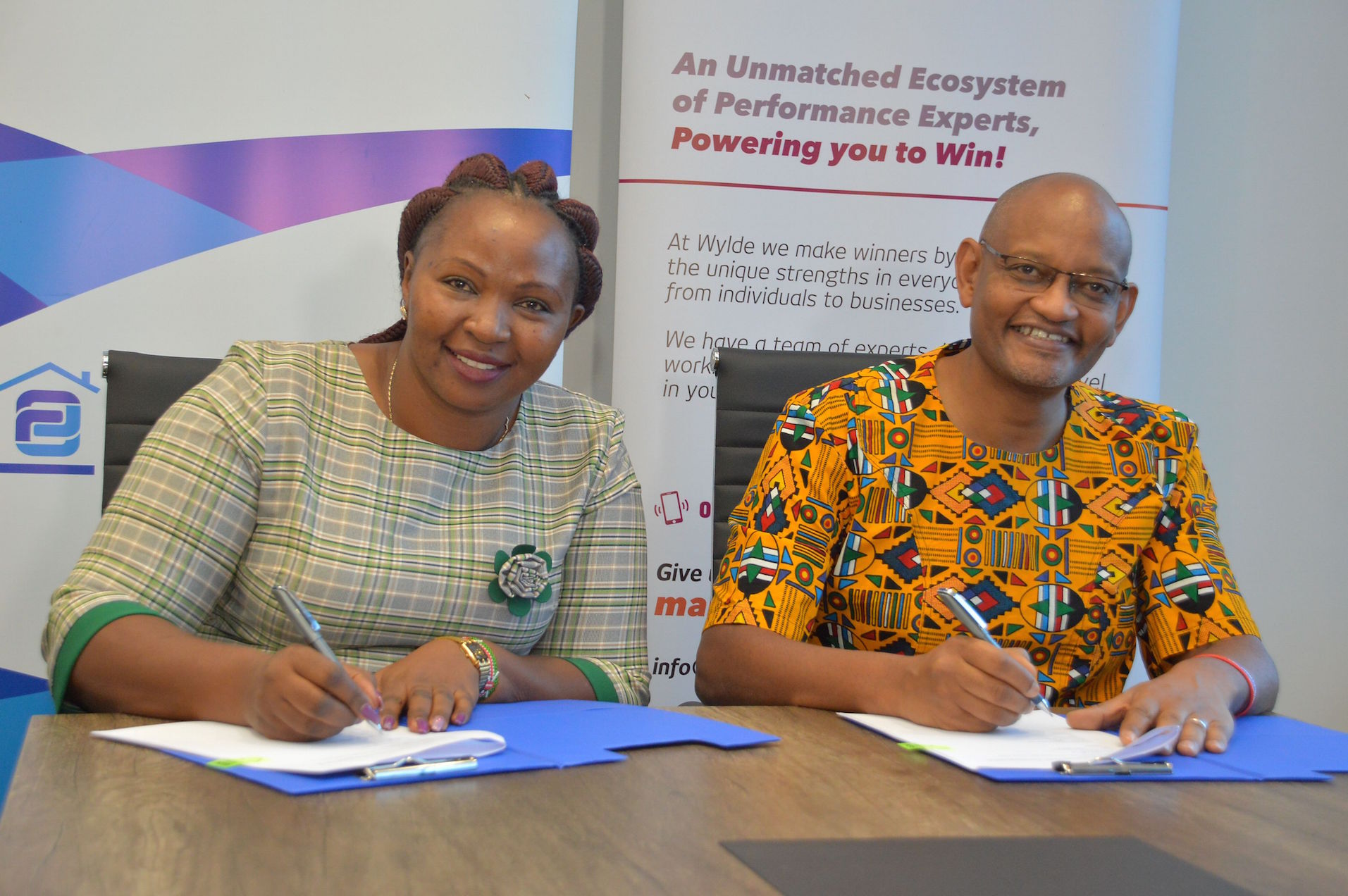 Family Bank Chief Retail Officer Phyllis Kimani and Wylde International Director Kiriinya Kithinji during the MOU signing of a partnership that will see them empower the Bank’s SMEs through capacity-building trainings.