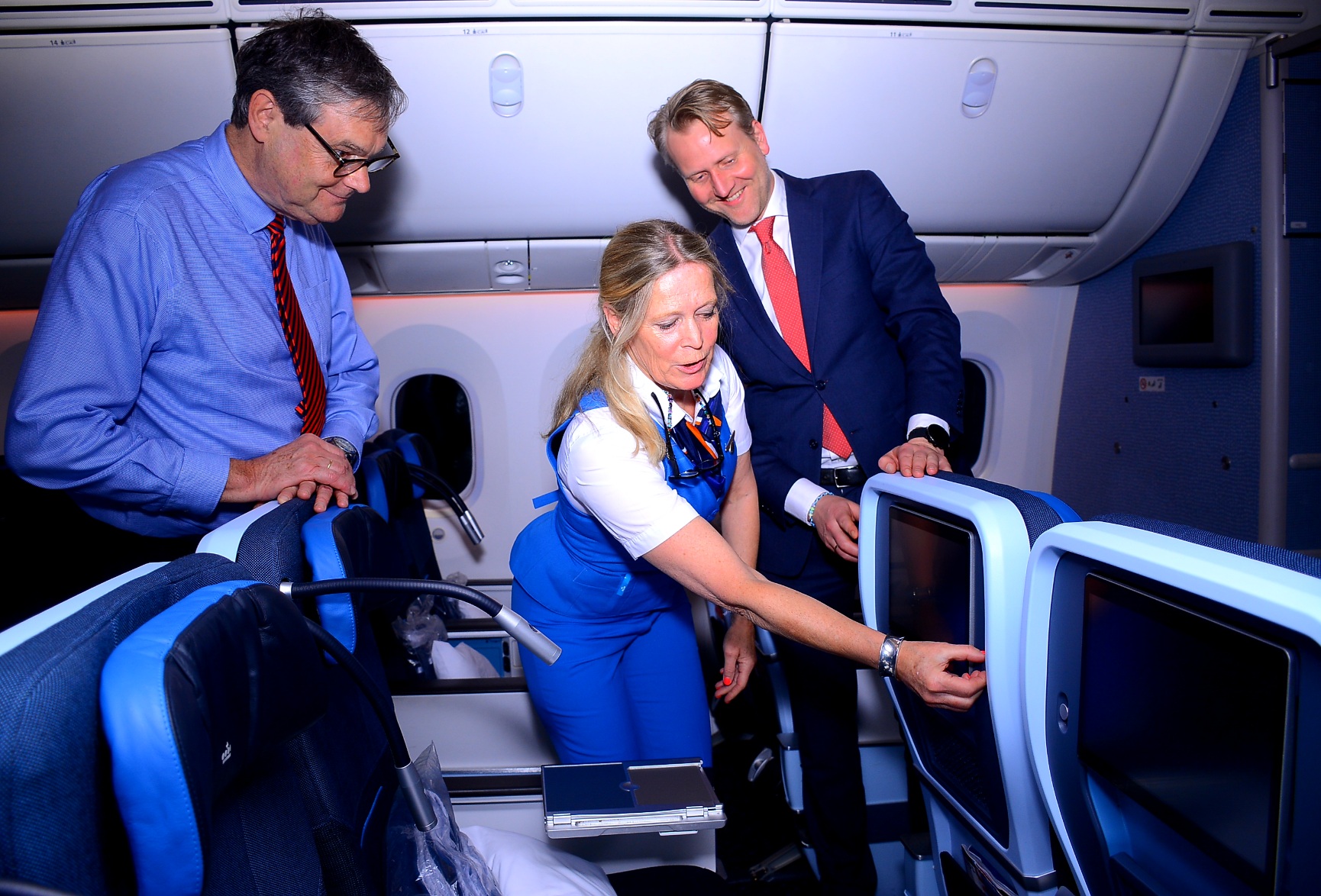 (L-R) AirFrance-KLM Regional Station Mr. Manager Peter Ordeman keenly watches as AirFrance- KLM Flight Purser Femke Legssen explains features of the new premium comfort cabin installed on all Boeing 777 and 787 aircraft flying to international destinations. Built In between economy class and business class, the new cabin is targeted at customers who want to enjoy the luxury of flying comfortably. Looking on is Air France-KLM General Manager for East and Southern Africa, Nigeria, and Ghana Mr. Marius van der Ham.