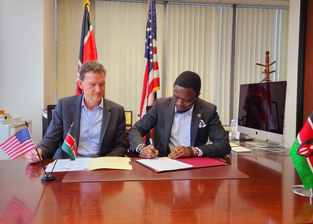 CS Ababu Namwamba and Invention Studios CEO Nicky Weinstock, sign the deal in Los Angeles. The deal institutes a comprehensive incentives framework to strategically position Kenya as a film making destination of choice. PHOTO/COURTESY
