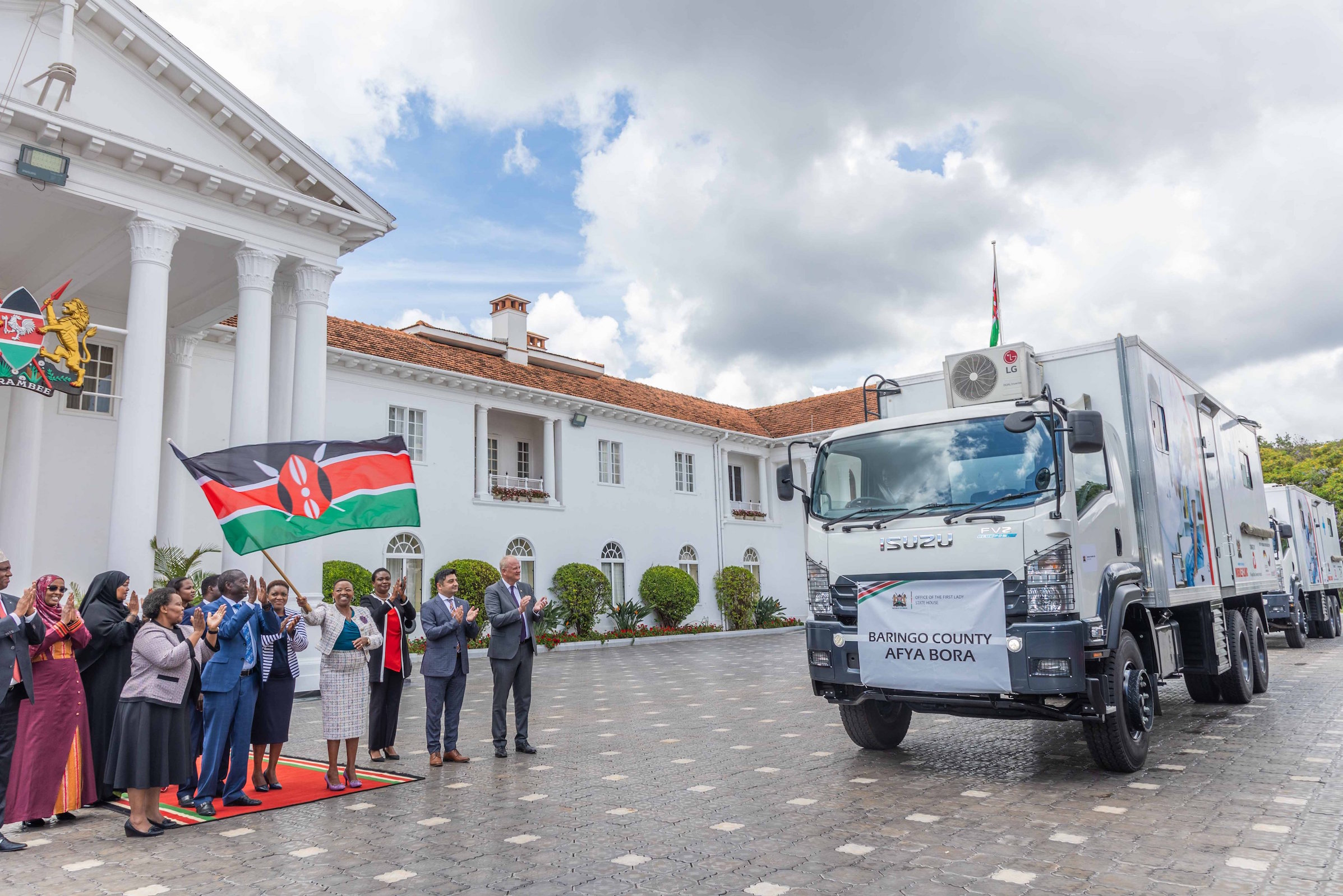 H.E. Mama Rachel Ruto, Kenya's First Lady, flags off three mobile clinics, fridges and transport freezers at State House donated by Aga Khan University Hospital and financed by the German Government through a grant offered by the German Development Bank (KFW). The donation valued at KES 63 million will support the implementation of the Universal Health Coverage programme in seven counties including Baringo, Marsabit, Samburu, Turkana, West Pokot, Mandera and Isiolo.