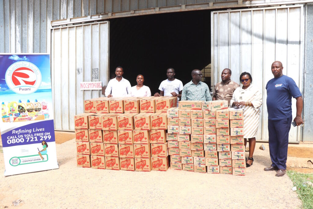 Pwani Oil and Isiolo North Constituency representatives pose for a photo after receiving a donation of cooking oil and hygiene products. The donation, intended to aid at least 1,000 families affected by the floods, showcases Pwani Oil's commitment to supporting the community in its recovery bid.