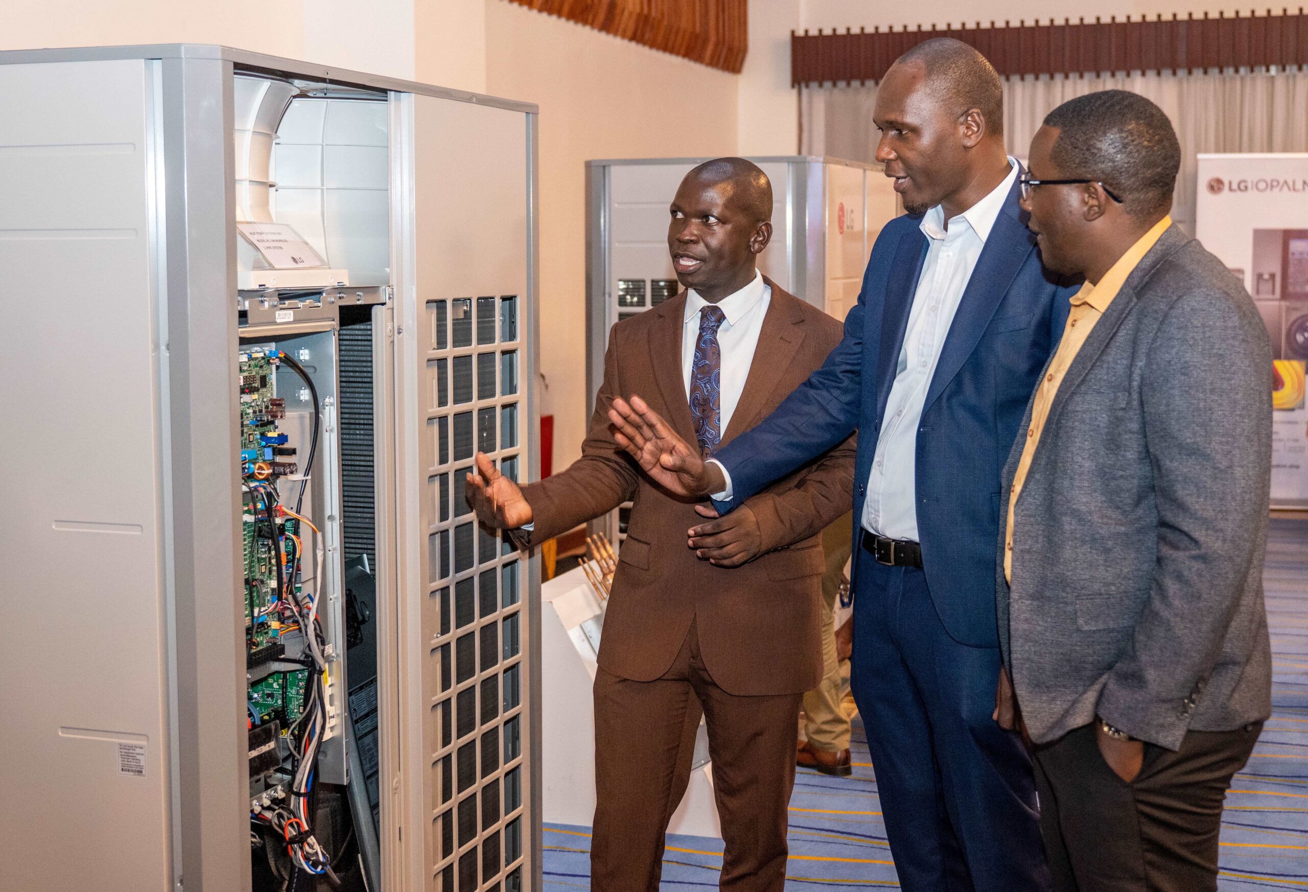 (L-R), LG Electronics EA Design SAC Design & Technical Training Engineer Barrack Onyango, LG Electronics East Africa Sales Manager for Commercial Air Conditioning Solutions Eric Kiprono Bett, and Opalnet Engineering Chief Executive Officer Brian Kitui discussing some of LG Electronics' cutting-edge air conditioning technologies during the LG-Opalnet Heating, Ventilation and Air Conditioning (HVAC) Night event
