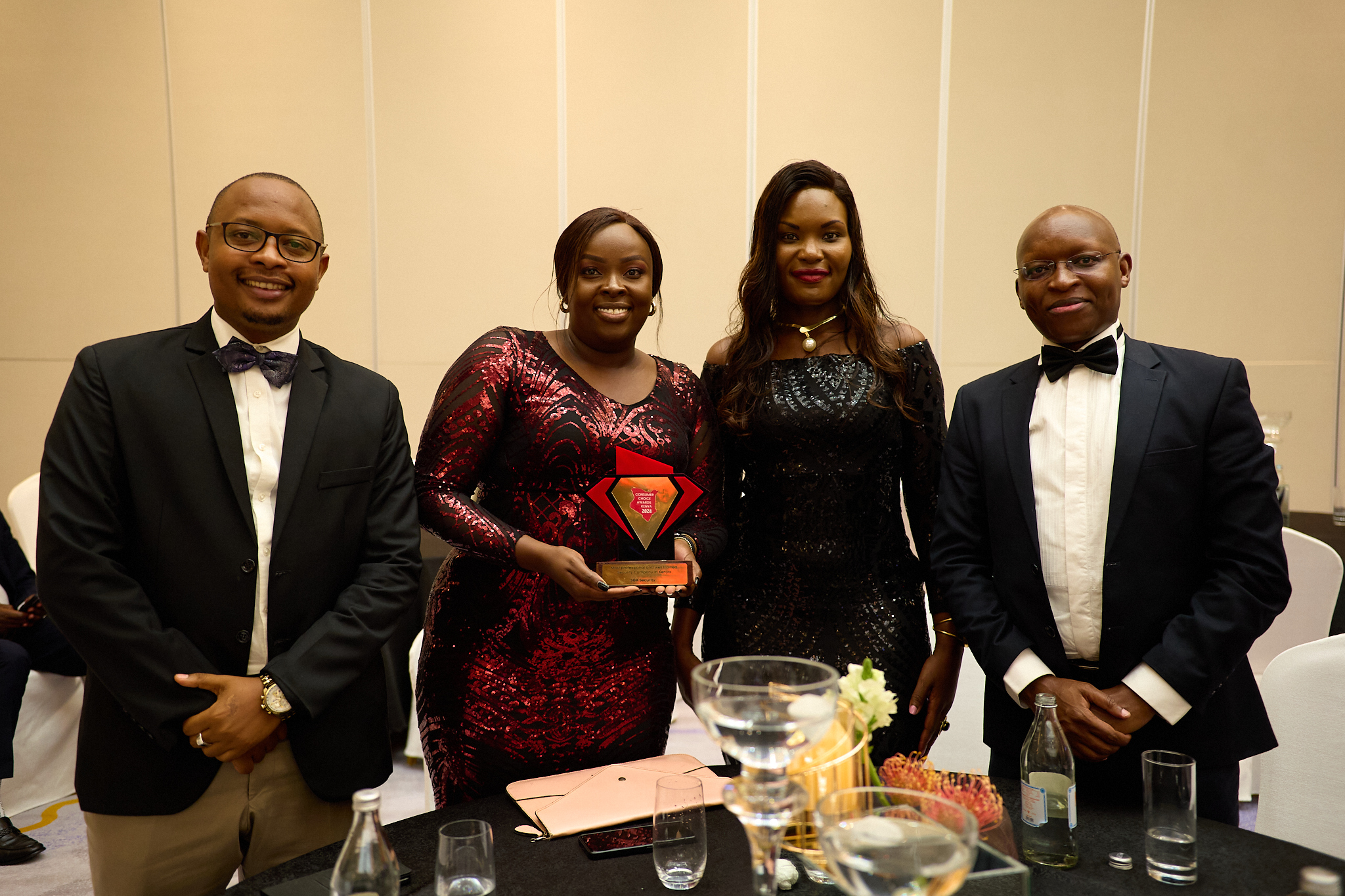 SGA Kenya Customer Service Manager Peter Kinyanjui, Group PR and Branding Manager Josephine Wanjiru, Sales & Marketing Manager Irene Opondo and Financial Controller Justus Kenyoru with the award trophy where SGA Security was recognized as the Most Professional and Well-Trained Security Company in Kenya award during the 2024 Consumer Choice Awards